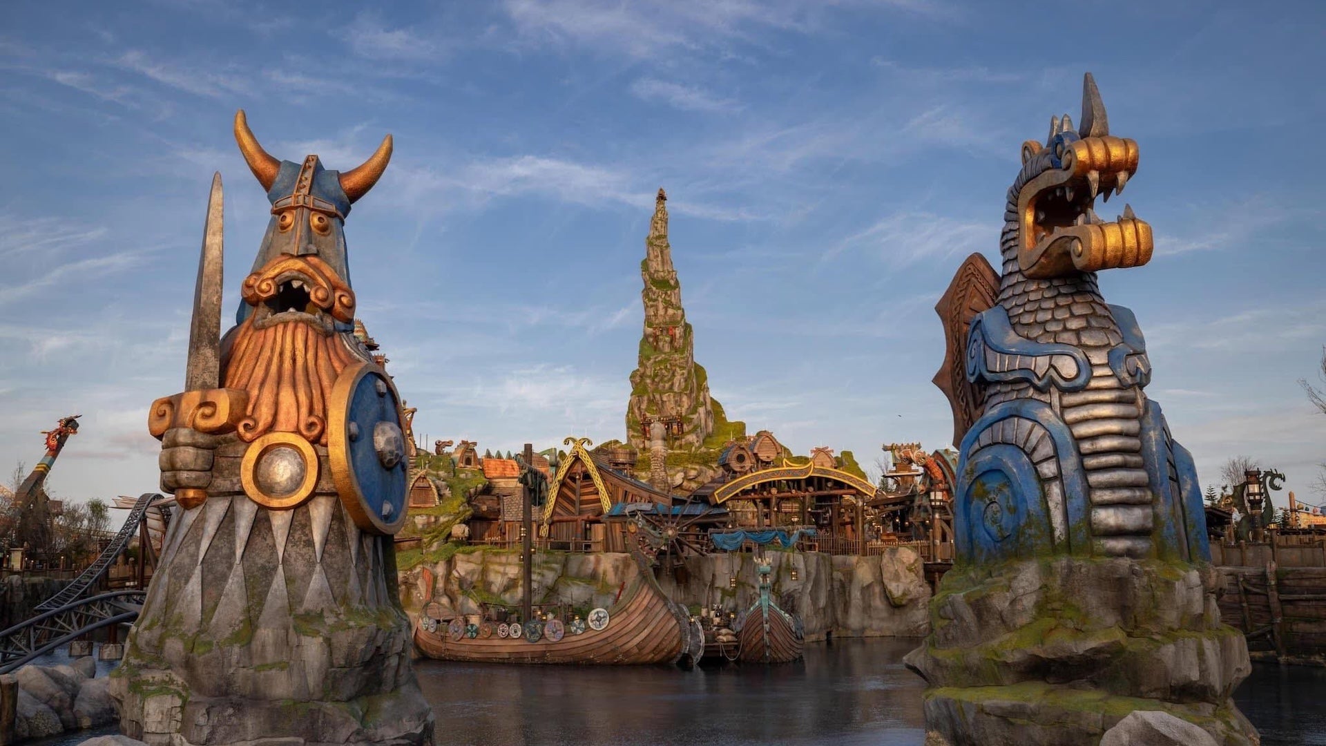 two big figures and a castle in a theme park